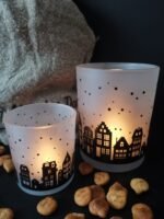 Glazen windlicht met huisjes