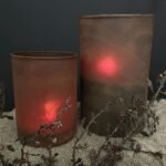 Glazen roest windlicht met een bruine kunsttak